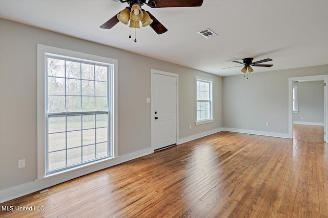 127 Autumn Dr, Vicksburg, MS 39180 - spare room featuring ceiling fan, wood finished floors, visible vents, and baseboards