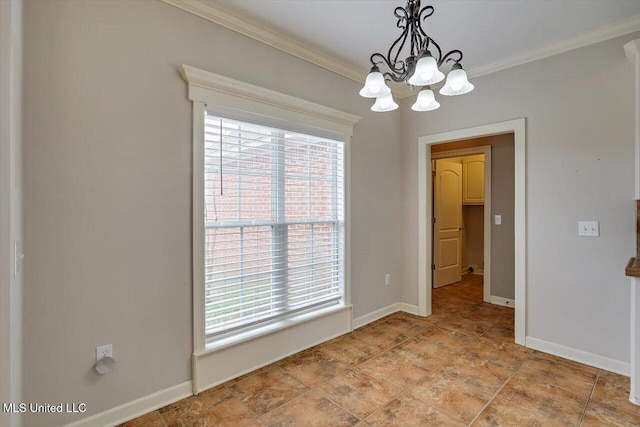 unfurnished dining area with ornamental molding and an inviting chandelier