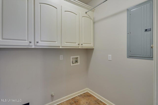 washroom with hookup for a washing machine, electric panel, and cabinets