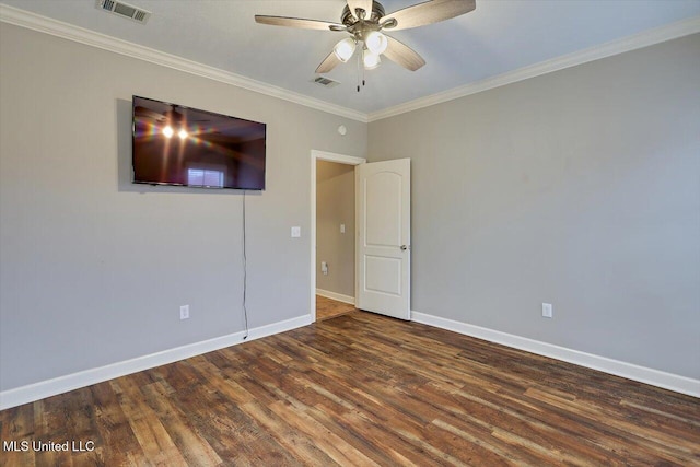 spare room featuring crown molding, ceiling fan, and dark hardwood / wood-style floors