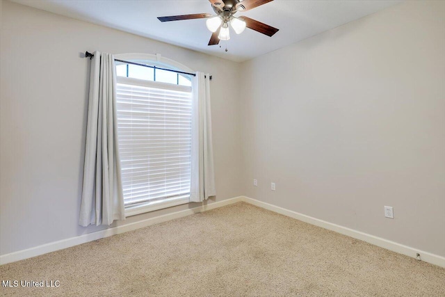 carpeted empty room with ceiling fan