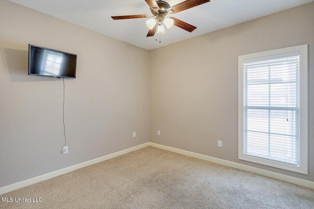 spare room with ceiling fan and carpet flooring