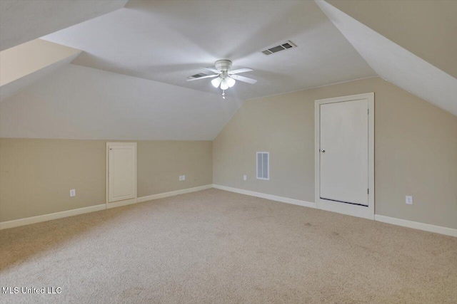 bonus room with light carpet, lofted ceiling, and ceiling fan