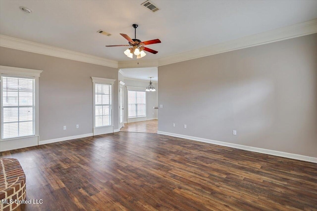 spare room with ceiling fan with notable chandelier, ornamental molding, and dark hardwood / wood-style floors