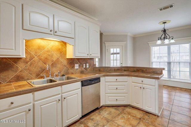 kitchen featuring sink, hanging light fixtures, dishwasher, kitchen peninsula, and white cabinets