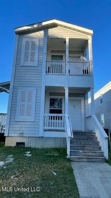 greek revival house with a balcony