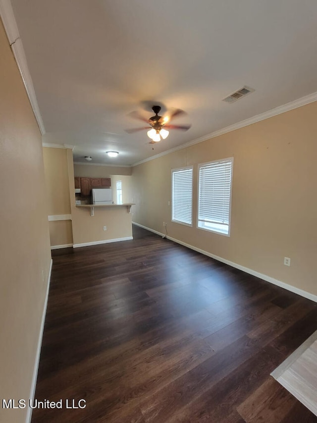 unfurnished living room featuring visible vents, a ceiling fan, baseboards, and crown molding