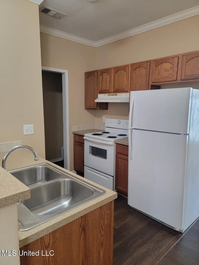 kitchen featuring crown molding, a sink, white appliances, brown cabinetry, and under cabinet range hood