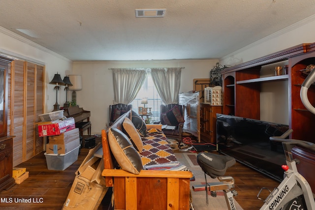 misc room with crown molding, dark hardwood / wood-style floors, and a textured ceiling