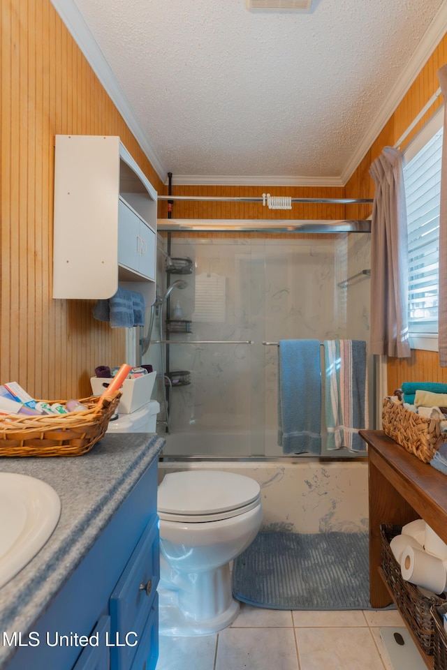 full bathroom with vanity, crown molding, bath / shower combo with glass door, and a textured ceiling