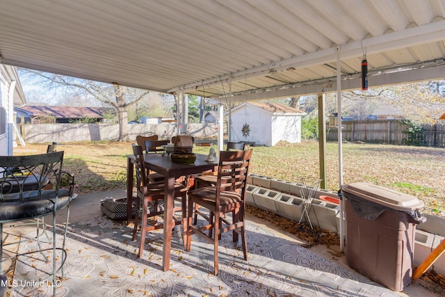 view of patio with a storage shed