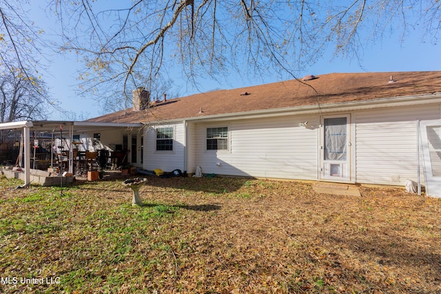 back of house with a yard