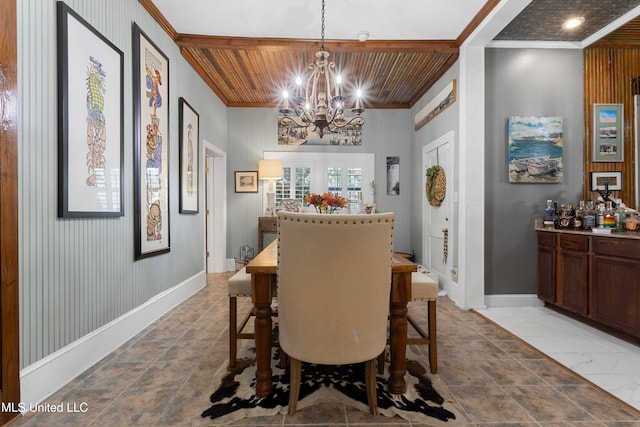 dining area featuring wooden walls, crown molding, wood ceiling, and a chandelier