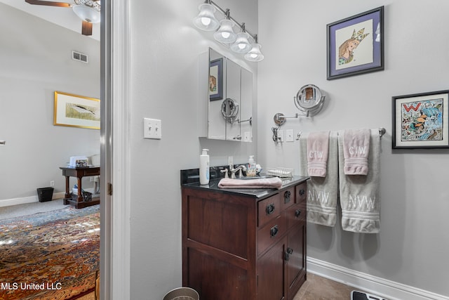 bathroom featuring vanity, ceiling fan, and tile patterned flooring