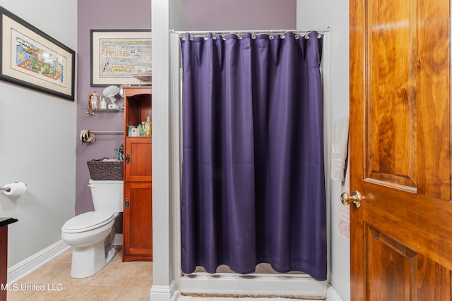 bathroom featuring walk in shower, toilet, and tile patterned flooring