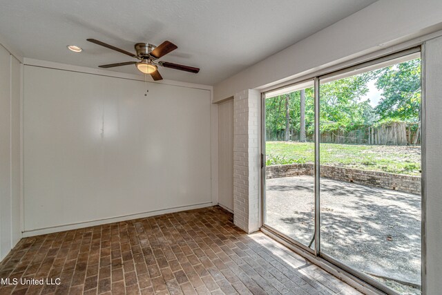 spare room with ceiling fan