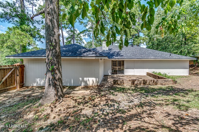 back of house with a patio