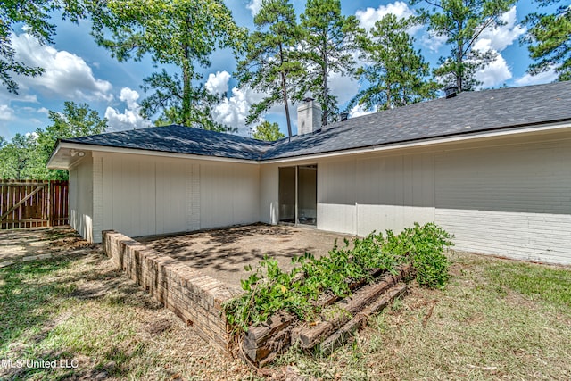 back of property featuring a patio