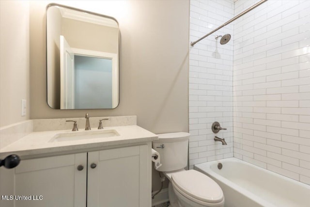 bathroom featuring vanity, shower / bath combination, and toilet
