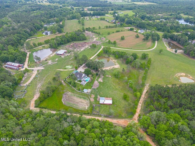 drone / aerial view with a water view and a rural view