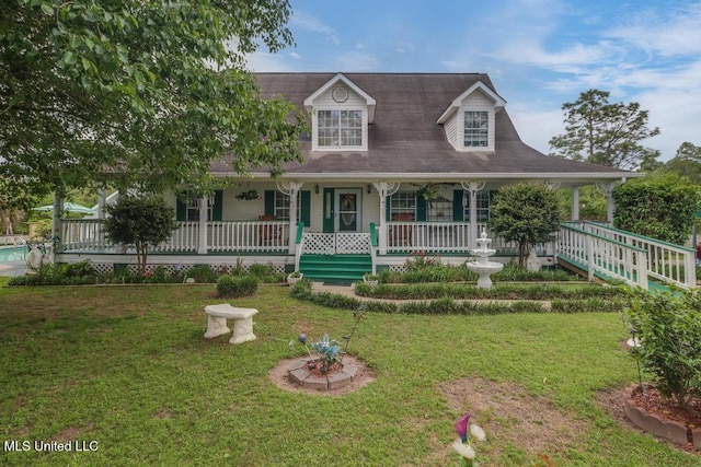 view of front of property with a porch and a front lawn