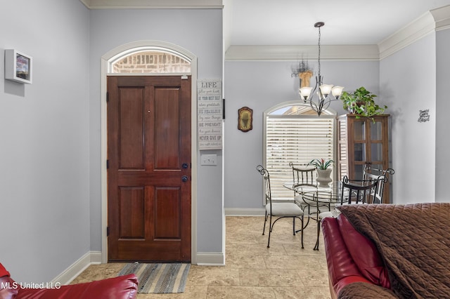 entrance foyer featuring crown molding and a notable chandelier