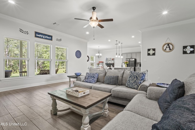 9363 Taylor Pl, Ocean Springs, MS 39564 - living area with a ceiling fan, ornamental molding, wood finished floors, recessed lighting, and baseboards