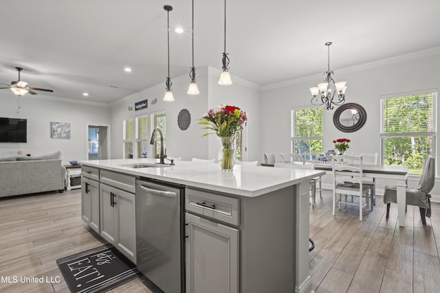 9363 Taylor Pl, Ocean Springs, MS 39564 - kitchen featuring a sink, stainless steel dishwasher, gray cabinets, light countertops, and light wood-style flooring