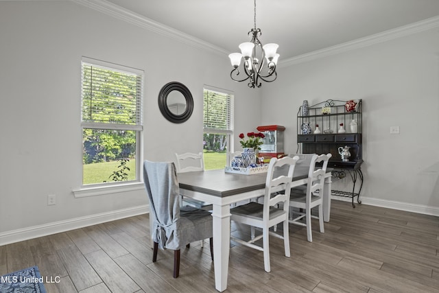 9363 Taylor Pl, Ocean Springs, MS 39564 - dining room featuring a chandelier, ornamental molding, healthy amount of natural light, and wood finished floors