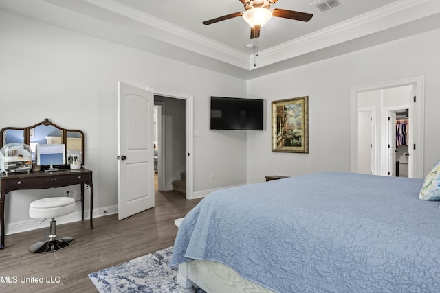 9363 Taylor Pl, Ocean Springs, MS 39564 - bedroom featuring crown molding, wood finished floors, baseboards, and a ceiling fan