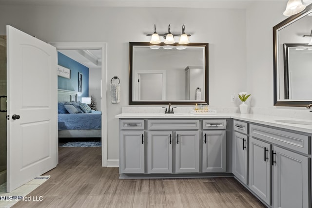 9363 Taylor Pl, Ocean Springs, MS 39564 - bathroom with wood finished floors, double vanity, ensuite bathroom, and a shower