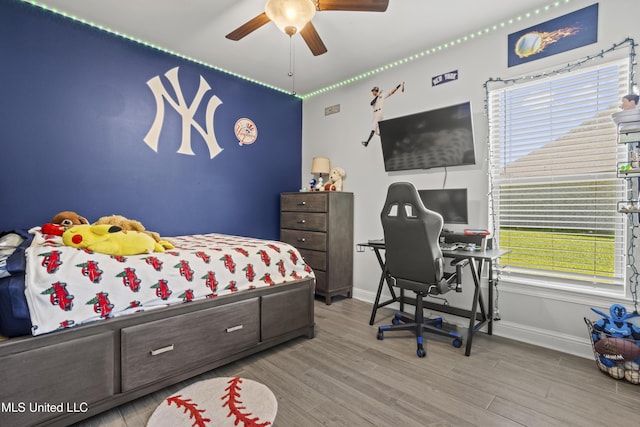 9363 Taylor Pl, Ocean Springs, MS 39564 - bedroom with wood finished floors, baseboards, and a ceiling fan