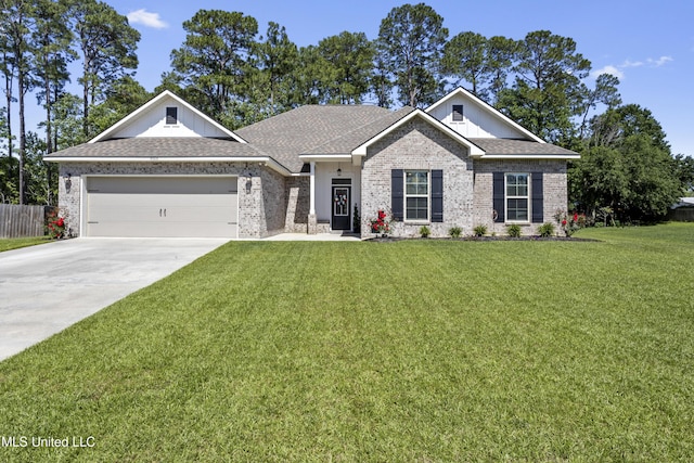 9363 Taylor Pl, Ocean Springs, MS 39564 - view of front of property with driveway, an attached garage, board and batten siding, brick siding, and roof with shingles