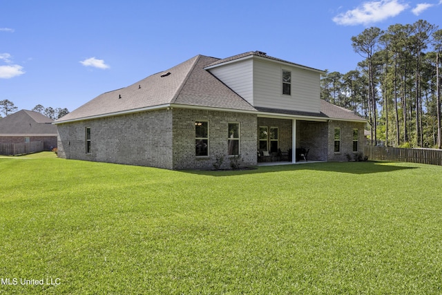 9363 Taylor Pl, Ocean Springs, MS 39564 - rear view of property featuring a patio, a shingled roof, and brick siding