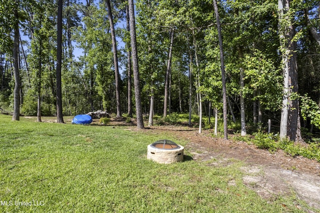 9363 Taylor Pl, Ocean Springs, MS 39564 - view of grassy yard with an outdoor fire pit