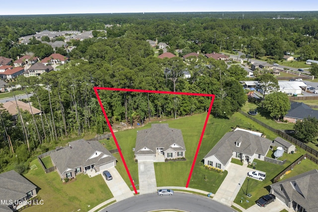 9363 Taylor Pl, Ocean Springs, MS 39564 - aerial perspective of suburban area with property boundaries highlighted and a heavily wooded area