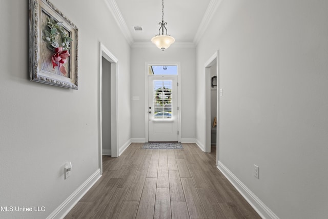 9363 Taylor Pl, Ocean Springs, MS 39564 - foyer with dark wood-style flooring, crown molding, and baseboards