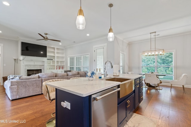 6731 Bobwhite Cir, Southaven, MS 38672 - kitchen with stainless steel dishwasher, a sink, ceiling fan, wood-type flooring, and crown molding