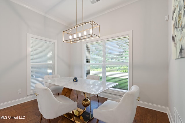 6731 Bobwhite Cir, Southaven, MS 38672 - dining space featuring a chandelier, baseboards, dark wood-style flooring, and ornamental molding