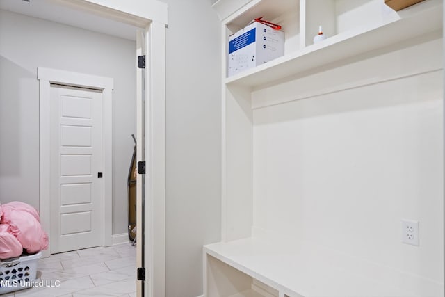 6731 Bobwhite Cir, Southaven, MS 38672 - mudroom featuring light marble finish floors and baseboards