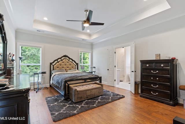 6731 Bobwhite Cir, Southaven, MS 38672 - bedroom featuring a tray ceiling, hardwood / wood-style flooring, recessed lighting, crown molding, and a ceiling fan