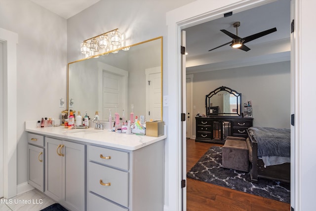 6731 Bobwhite Cir, Southaven, MS 38672 - bathroom with ceiling fan, vanity, and wood finished floors