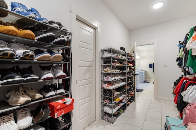 6731 Bobwhite Cir, Southaven, MS 38672 - walk in closet featuring light marble finish floors