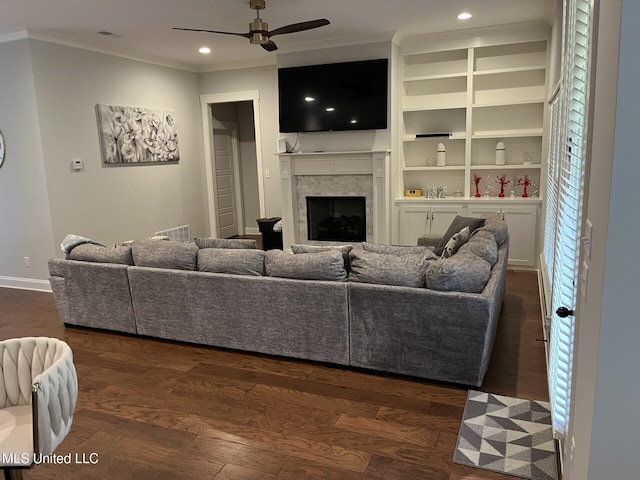 6731 Bobwhite Cir, Southaven, MS 38672 - living room with ceiling fan, crown molding, dark wood-style floors, a fireplace, and baseboards