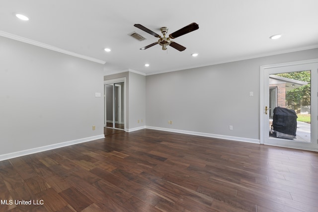 spare room featuring crown molding, dark hardwood / wood-style floors, and ceiling fan