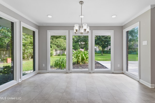 doorway to outside with crown molding, a notable chandelier, and plenty of natural light