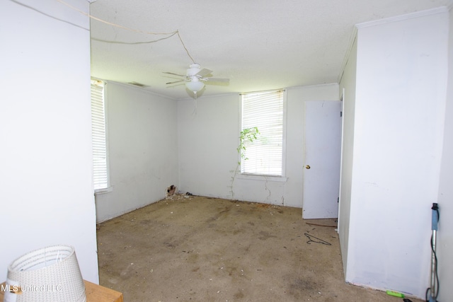 spare room with a ceiling fan