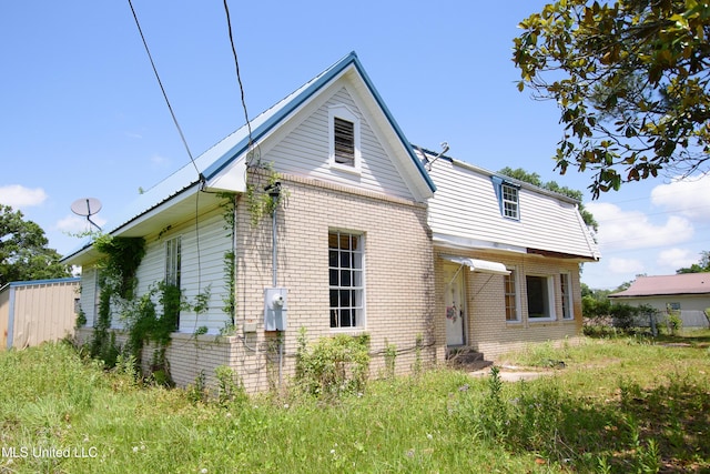 view of front of home with brick siding