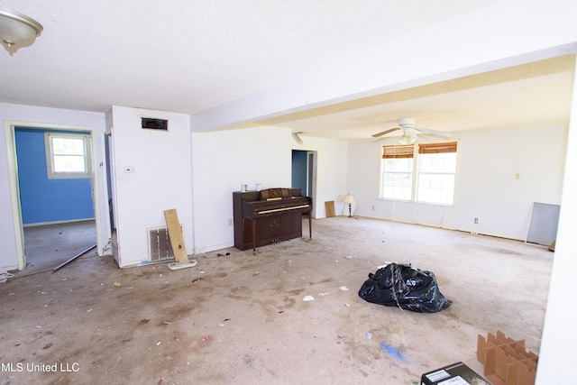 living area with a ceiling fan