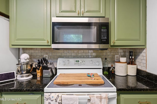 kitchen with electric stove, decorative backsplash, and green cabinetry